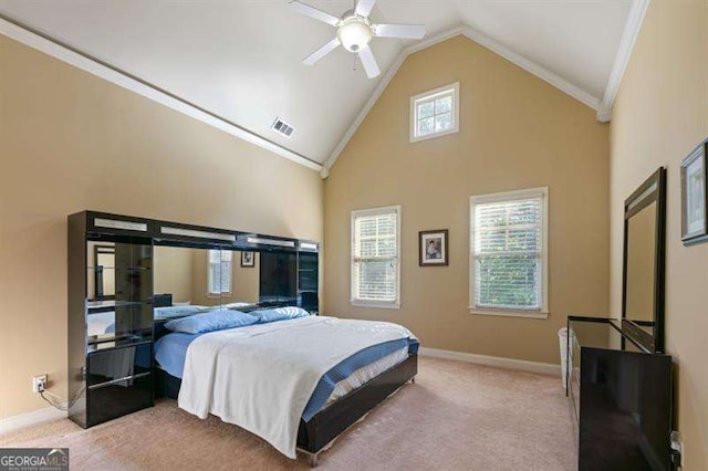 carpeted bedroom with high vaulted ceiling, ceiling fan, and crown molding