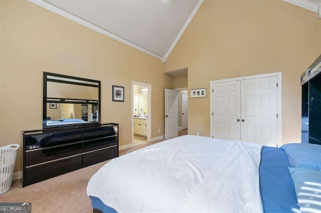 bedroom with ensuite bath, high vaulted ceiling, crown molding, a closet, and carpet