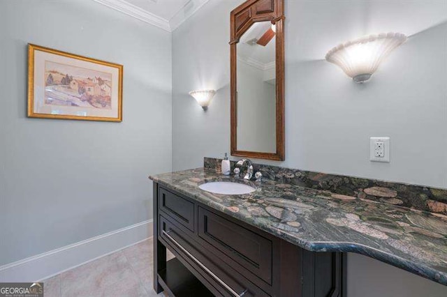 bathroom featuring crown molding and vanity