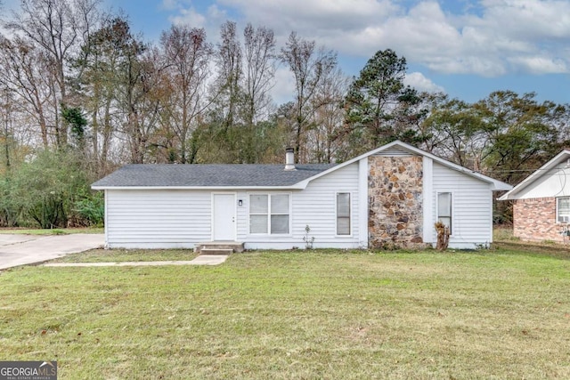 rear view of house with a lawn