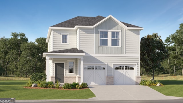 view of front of home with a front yard and a garage