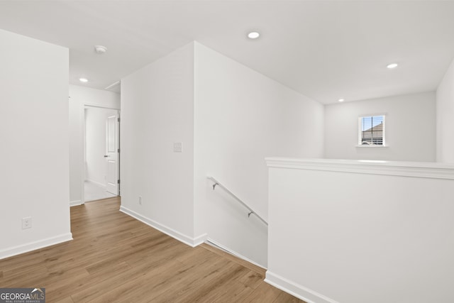 hallway with light wood-type flooring