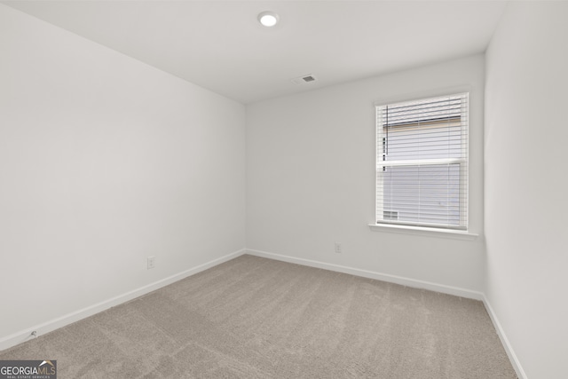 unfurnished room with carpet floors