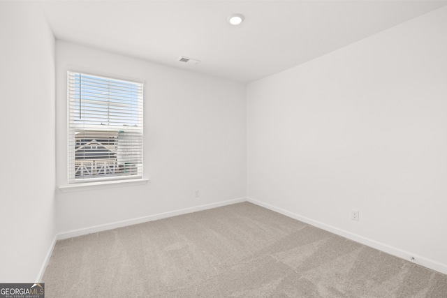 spare room featuring carpet floors