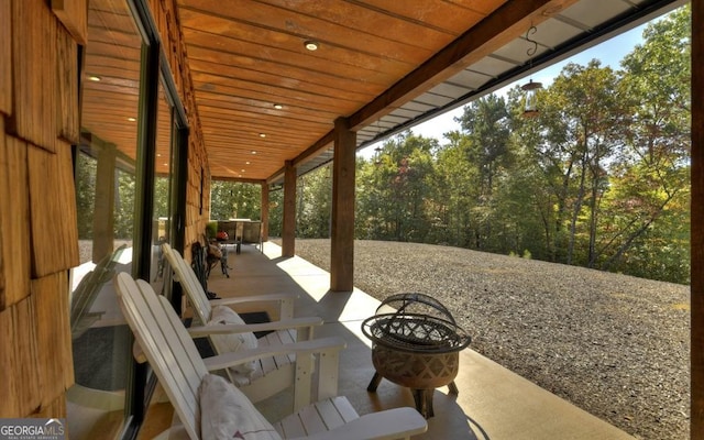 view of patio with a fire pit