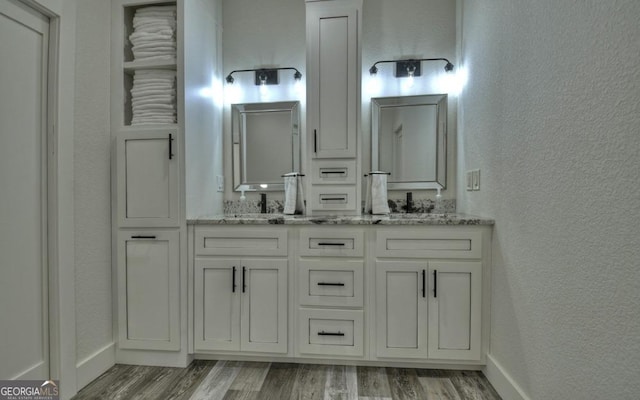 bathroom featuring hardwood / wood-style floors and vanity