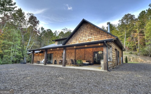 rear view of property with a patio area