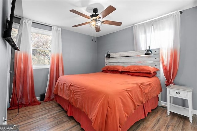 bedroom featuring ceiling fan and wood-type flooring