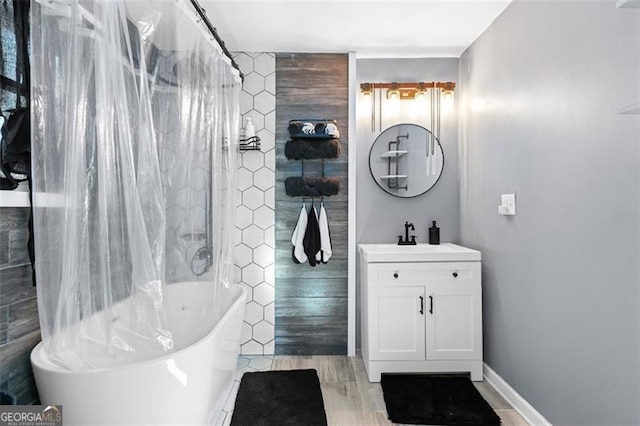 bathroom with shower / bath combo and vanity