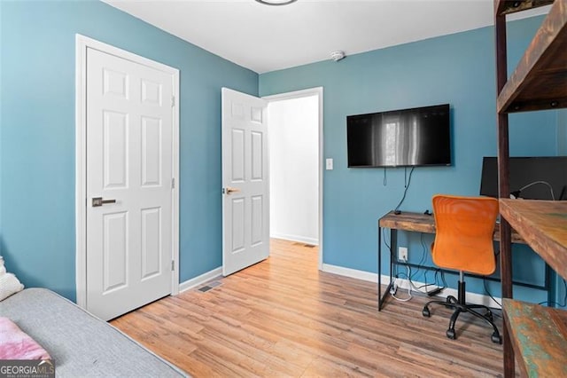 office area with light hardwood / wood-style floors