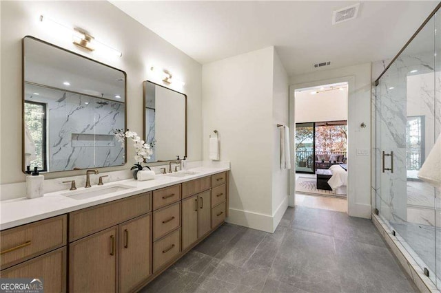 bathroom featuring vanity and a shower with shower door