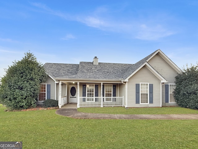 single story home with covered porch and a front yard