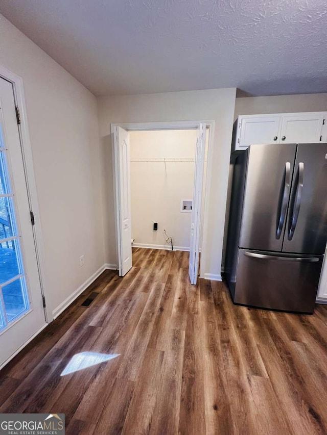 laundry area with hookup for a washing machine, dark hardwood / wood-style flooring, and a textured ceiling