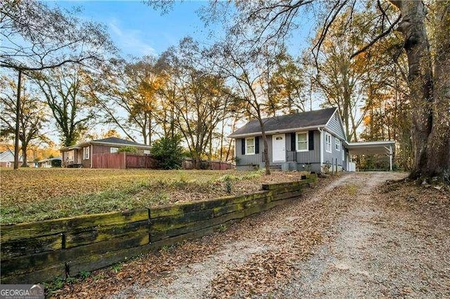 single story home featuring a carport