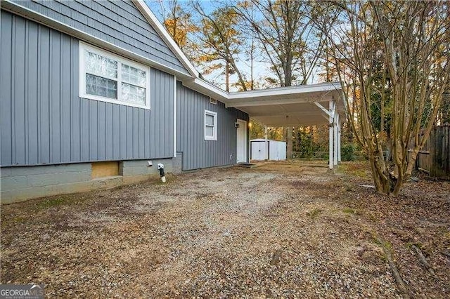 view of side of home featuring a carport