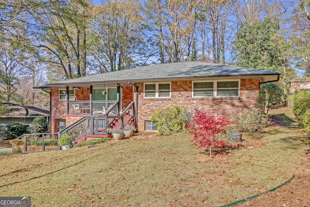 ranch-style house with a porch and a front yard