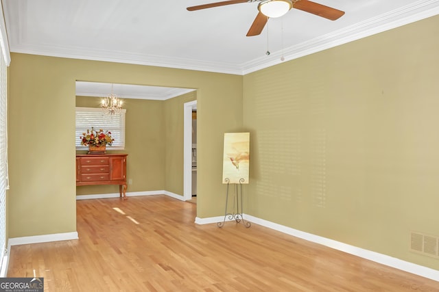 unfurnished room with crown molding, hardwood / wood-style floors, and ceiling fan with notable chandelier