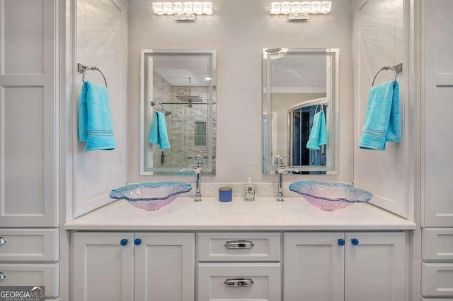 bathroom featuring vanity and an enclosed shower