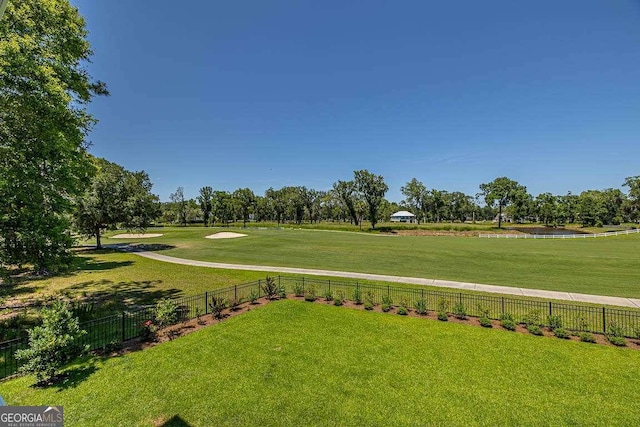 view of home's community featuring a rural view and a yard