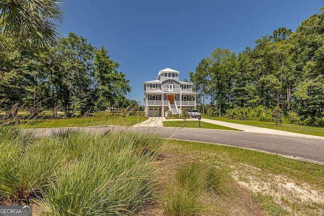 raised beach house with a garage