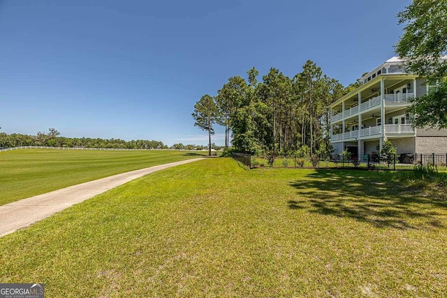 view of home's community featuring a lawn