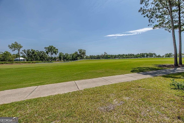 view of community featuring a yard