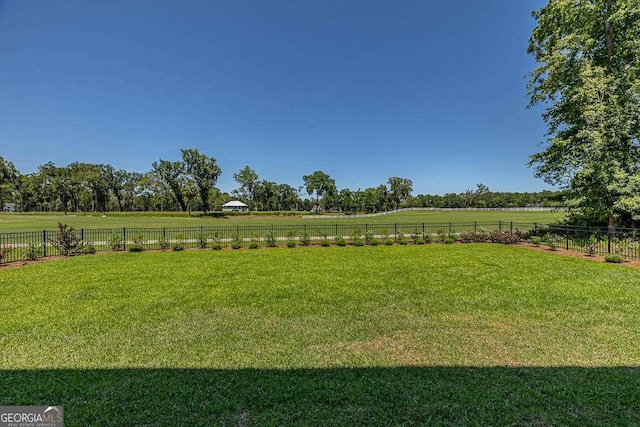 view of yard with a rural view