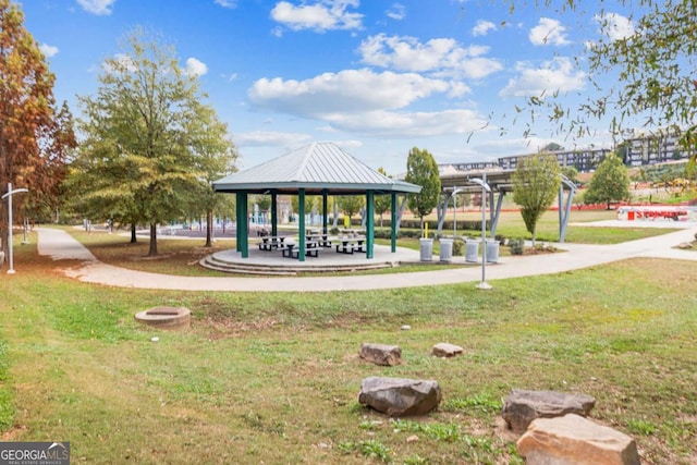 surrounding community with a gazebo and a lawn