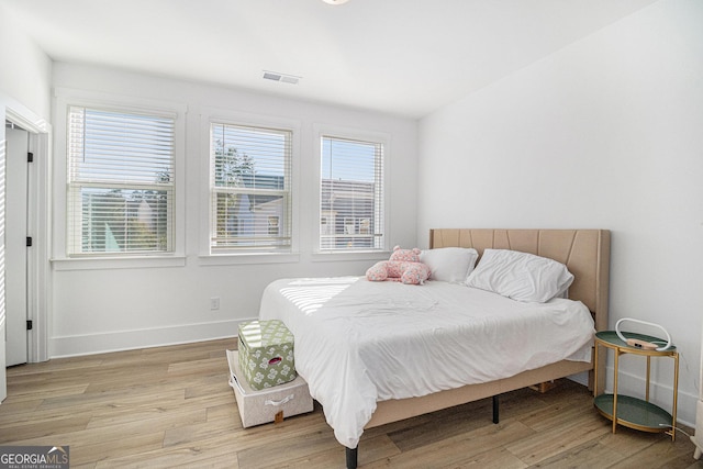 bedroom with light hardwood / wood-style floors