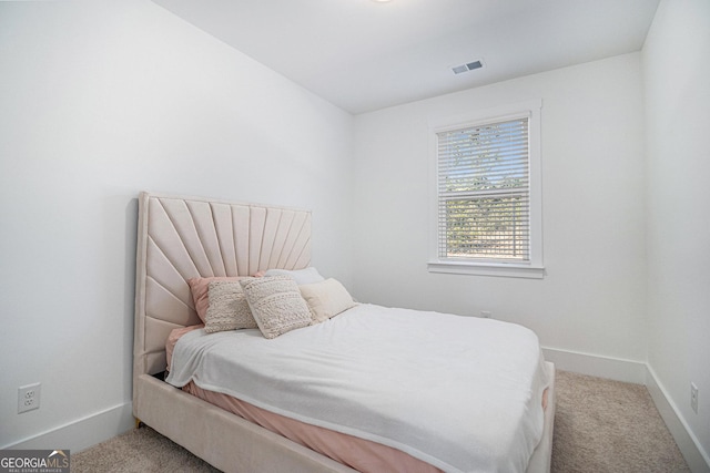 bedroom with light carpet