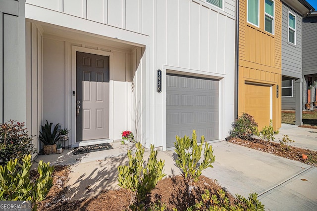 doorway to property featuring a garage