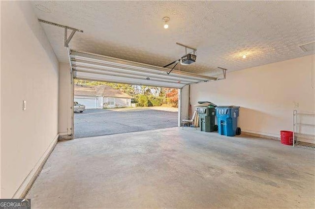 garage featuring a garage door opener