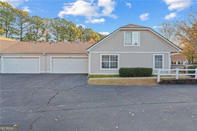 ranch-style home featuring a garage