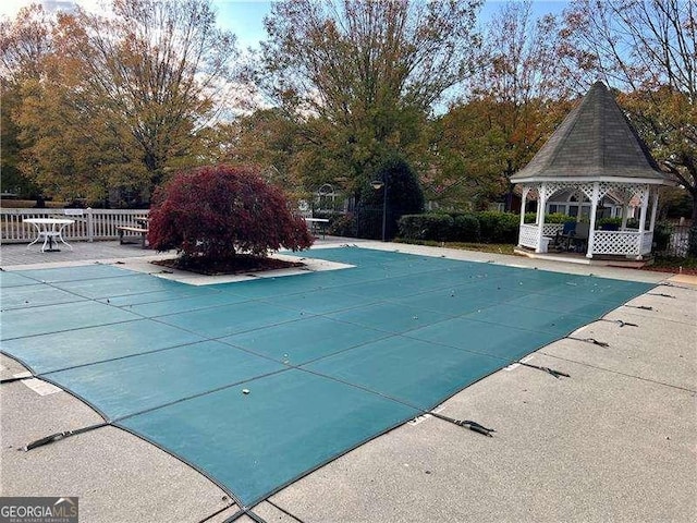 view of swimming pool featuring a gazebo and a patio