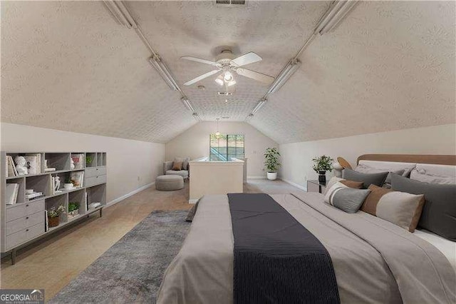 bedroom with a textured ceiling, light colored carpet, vaulted ceiling, and ceiling fan