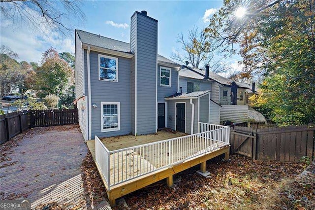 rear view of property with a deck