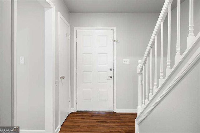 entrance foyer with dark hardwood / wood-style floors