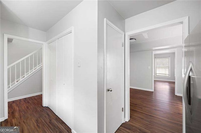 hall with dark wood-type flooring