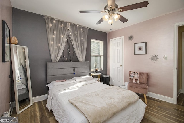 bedroom featuring ceiling fan and dark wood-type flooring