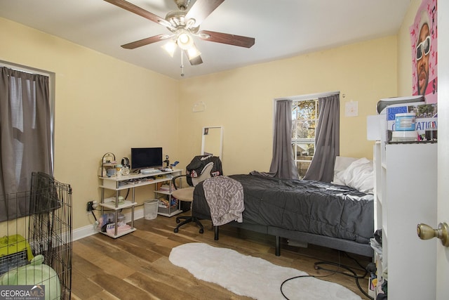 bedroom featuring ceiling fan and hardwood / wood-style floors