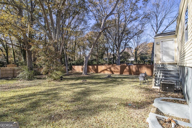 view of yard with central AC unit