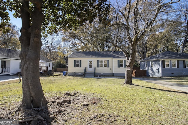 ranch-style house with a front lawn