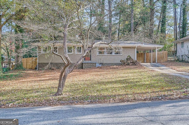 single story home with a carport and a front lawn