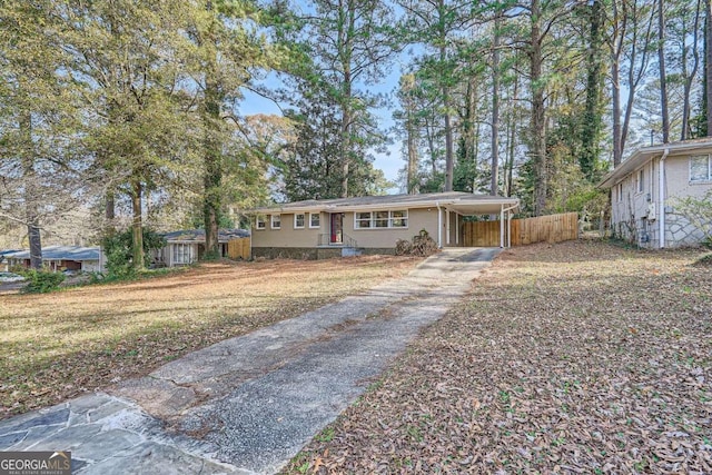 single story home with a carport