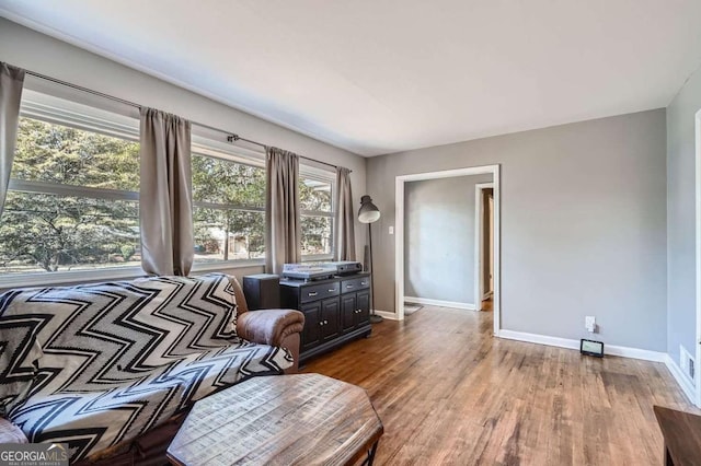 living area with hardwood / wood-style flooring