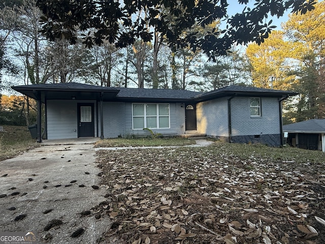 view of front of home with a carport