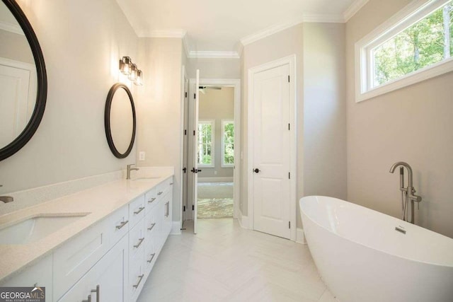 bathroom featuring a tub to relax in, vanity, and ornamental molding