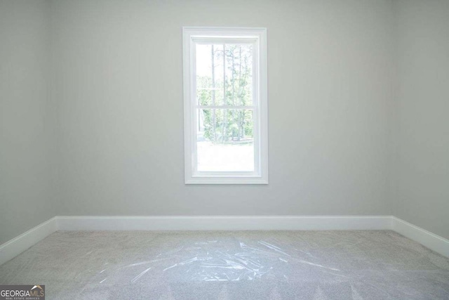 unfurnished room with carpet flooring