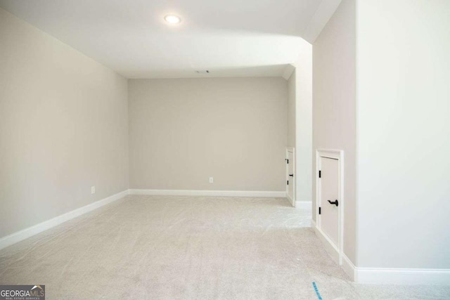 spare room with light carpet