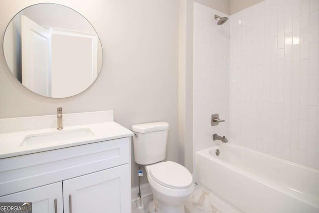 full bathroom featuring toilet, vanity, and tiled shower / bath